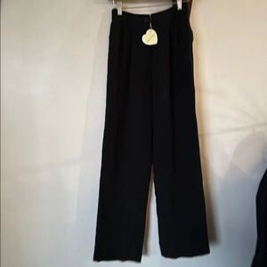 New with tags Mirror Palais black slacks. Size small. Excellent condition.